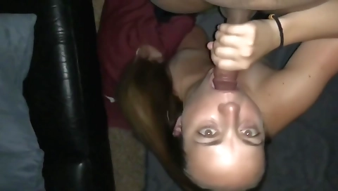 Brunette milf sucks on a deepthroat cock and gives a handjob