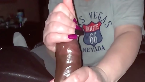 Mature bitch handjob and a hot cumshot in porn video