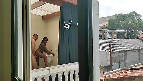 Brunette in red dress and a black top with a black bra