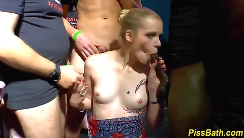 Blonde with a tattooed pussy in a shower is sucking a big cock