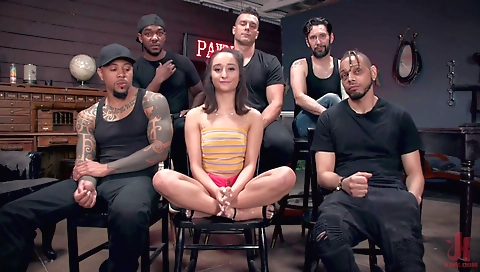 Busty brunette in a white dress and white dildo in her pussy