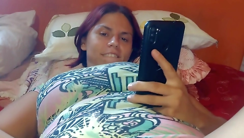 Redheaded girl with big tits is getting fucked in the anal