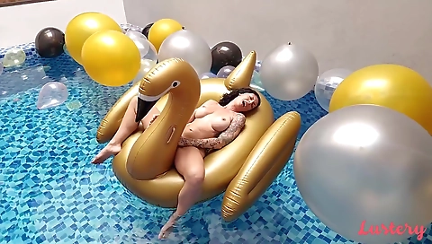 Busty brunette gets a facial from a black dude in the pool